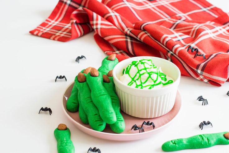 These Witch Finger Cookies are not for the faint of heart - add the extra 'creep factor' in your upcoming Halloween party with these super green treats! #halloweendesserts