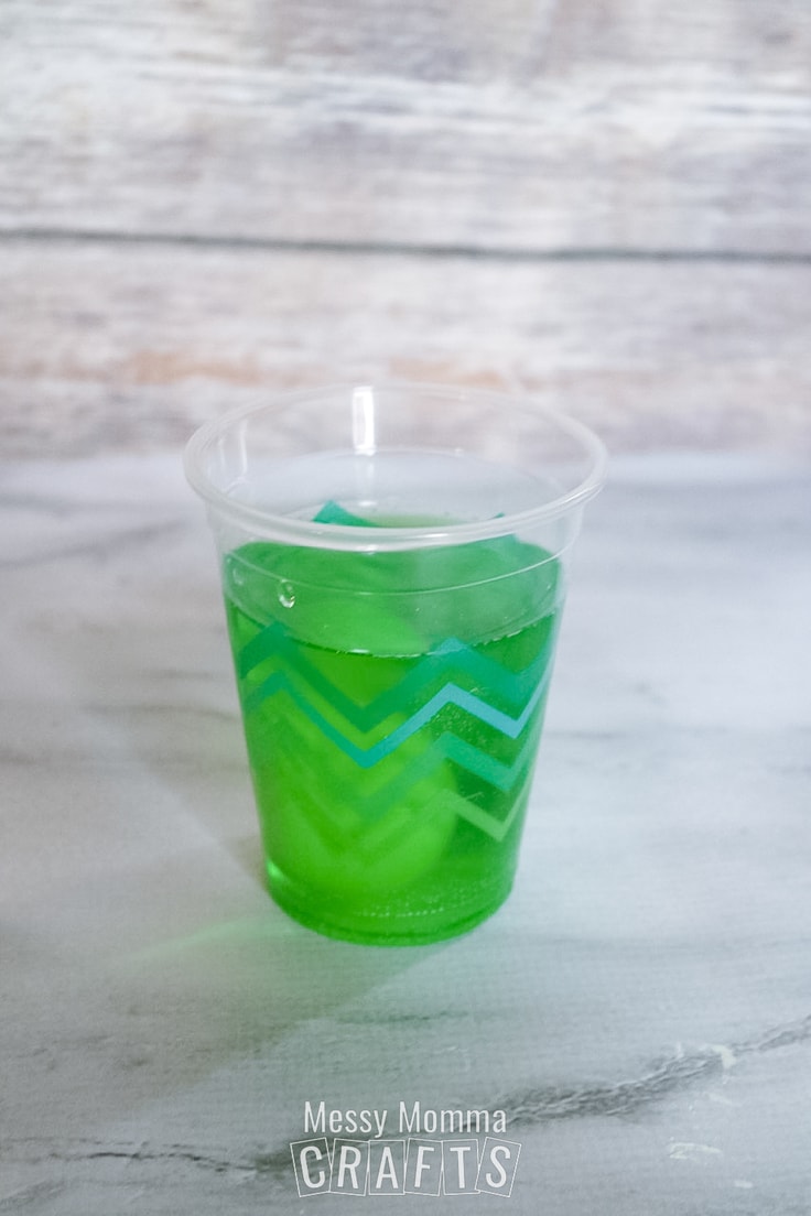 Green dye in a plastic cup.