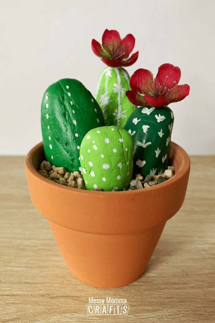 Rocks painted as cactus in a clay pot.