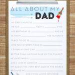 All About My Dad free printable attached to a clipboard on a wood background.