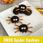 OREO Spider Cookies Spooky Halloween Treats on a white plate with Candy Corn in the background.