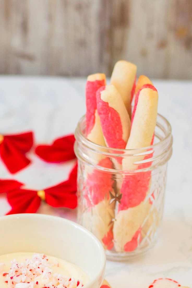 Candy cane cookies in a glass jar.