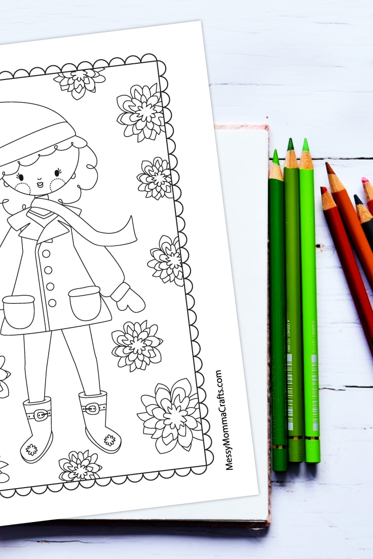 Preview of a winter lady Christmas themed coloring page on white wooden desk with assorted colored pencils on the right.