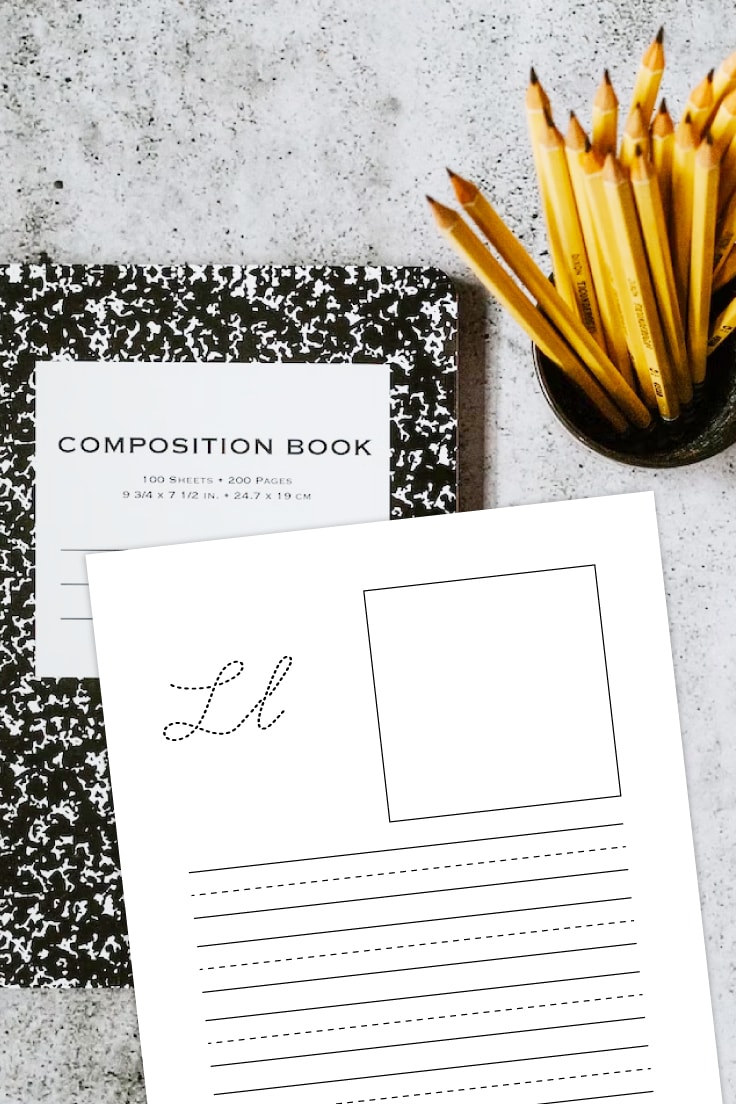 Preview of L cursive letter printable page on a marble countertop with composition notebook and jar of pencils showing.