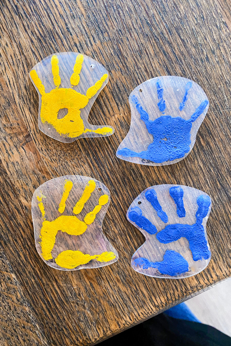 Blue and yellow shrinky dink handprints