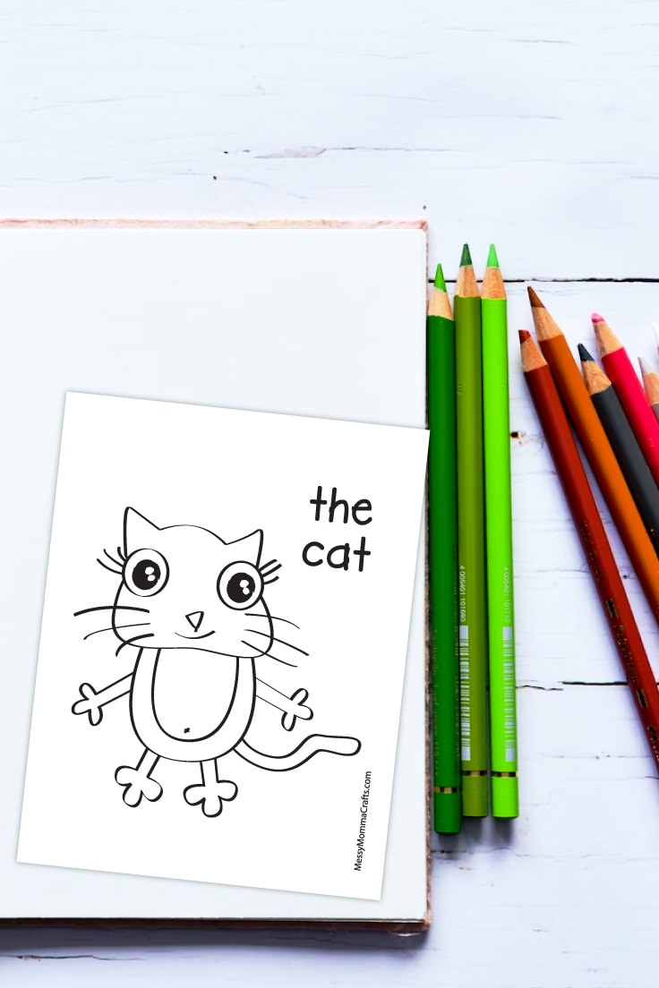 Preview of cat coloring page on white wooden background with some colored pencils on the right side spread out. 