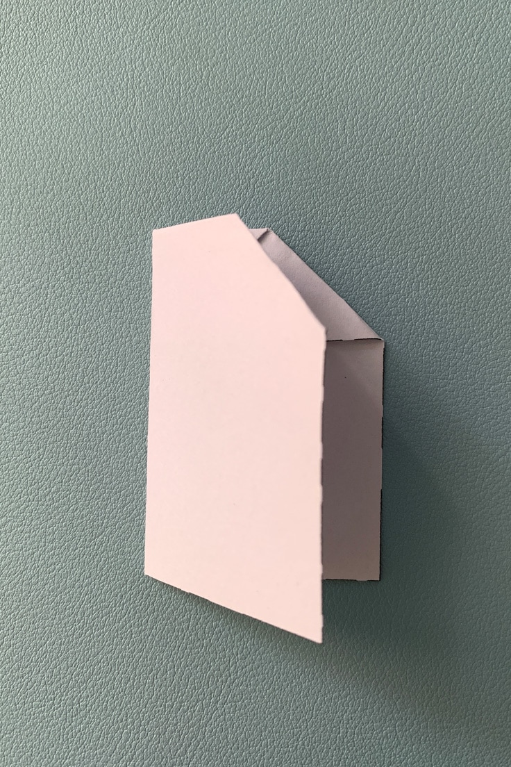 Paper airplane folded in half.