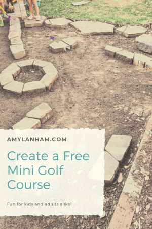 Backyard mini golf course set up with edging bricks