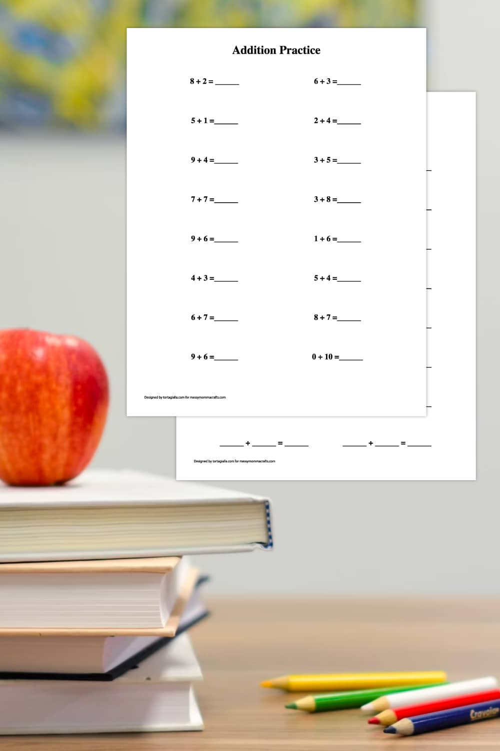 Background of classroom with desk with books and apple on top and colored pencils on the right, with preview of math worksheets in upper right. 