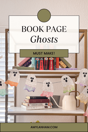 Book page ghosts hanging on a bookshelf. The bottom of the ghosts are different colors