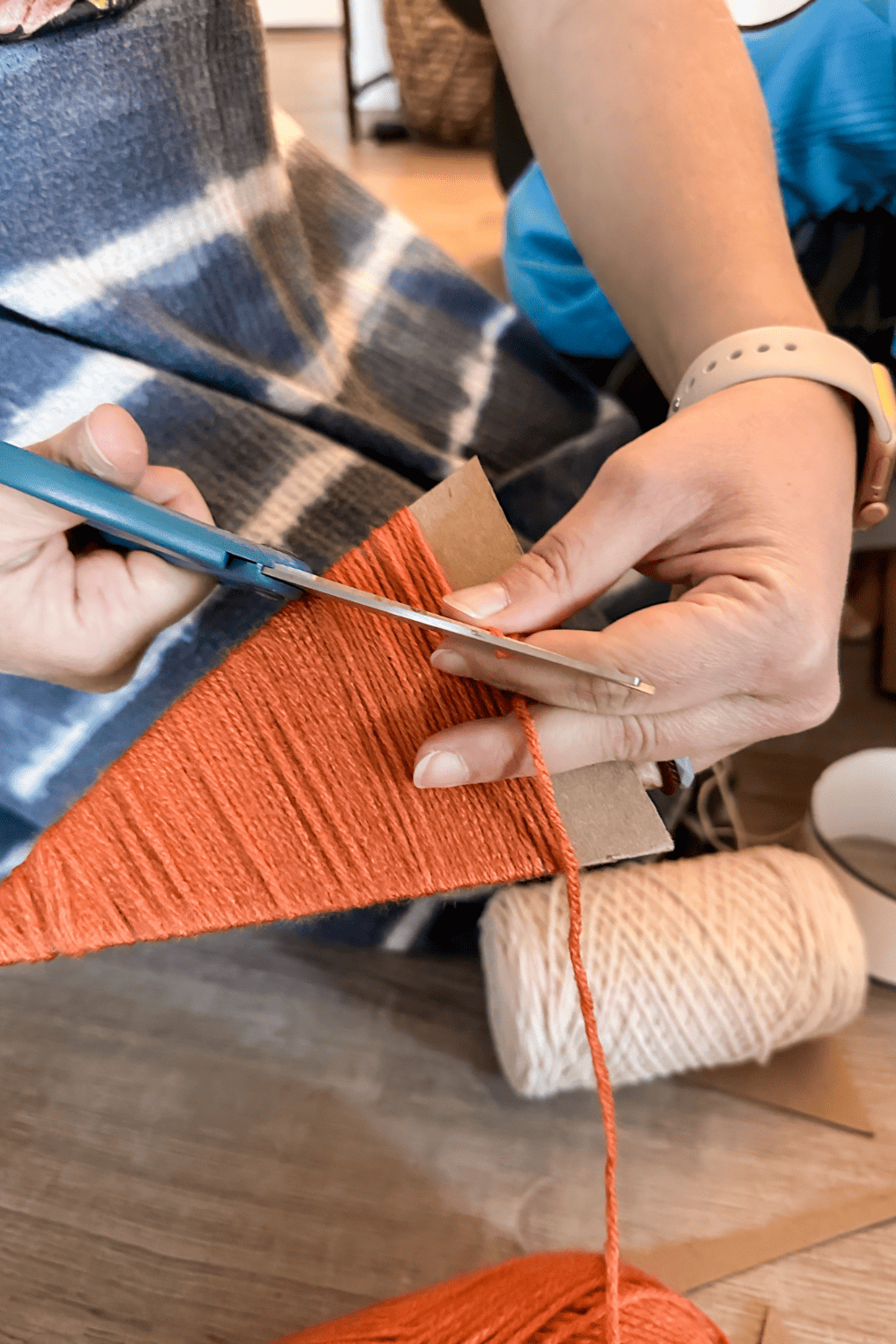 Woman cutting yarn 