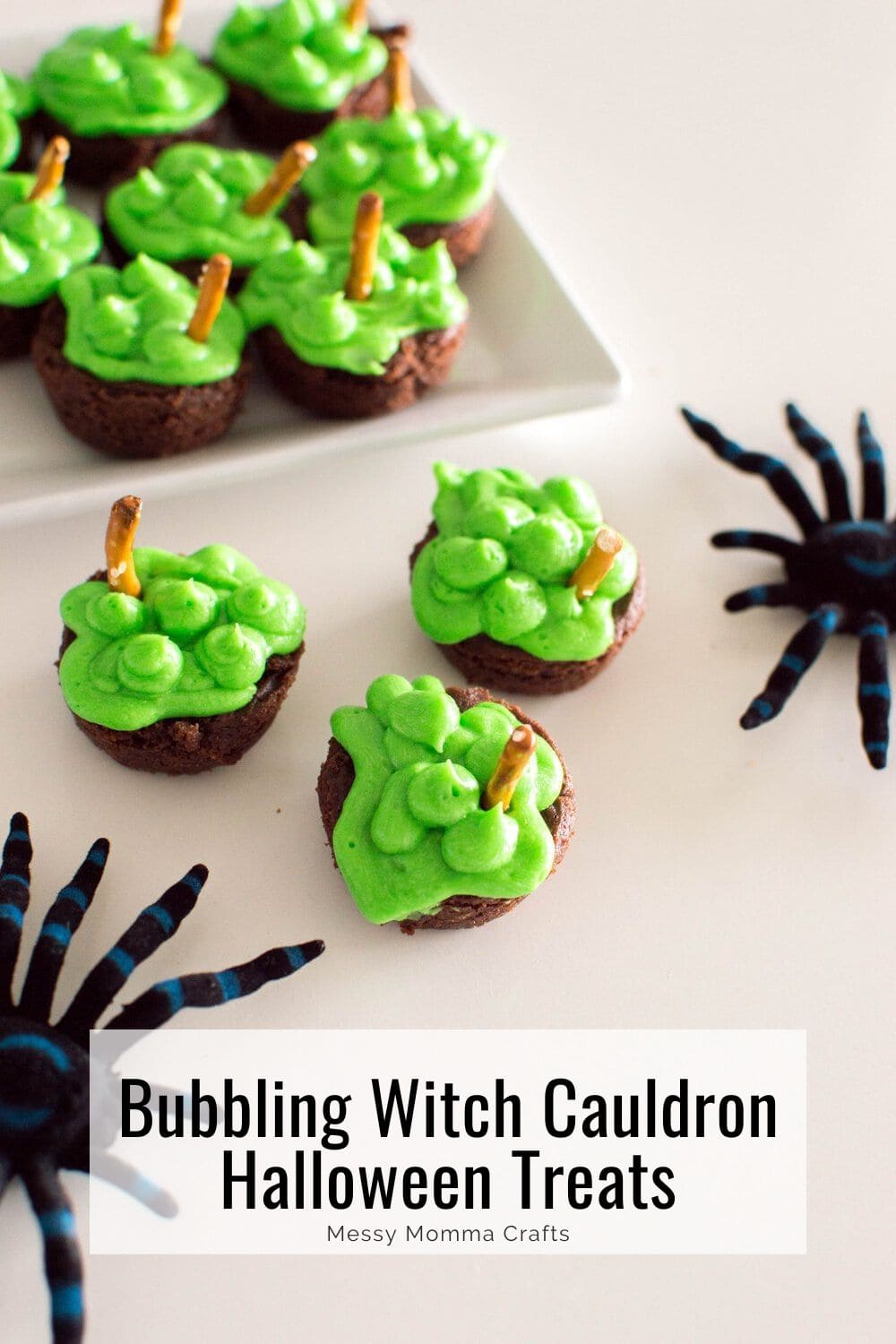 Bubbling witch cauldron Halloween treats with green frosting and a pretzel stir stick.