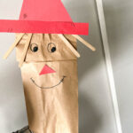 A homemade paper bag scare crow used as a puppet and a great autumn craft