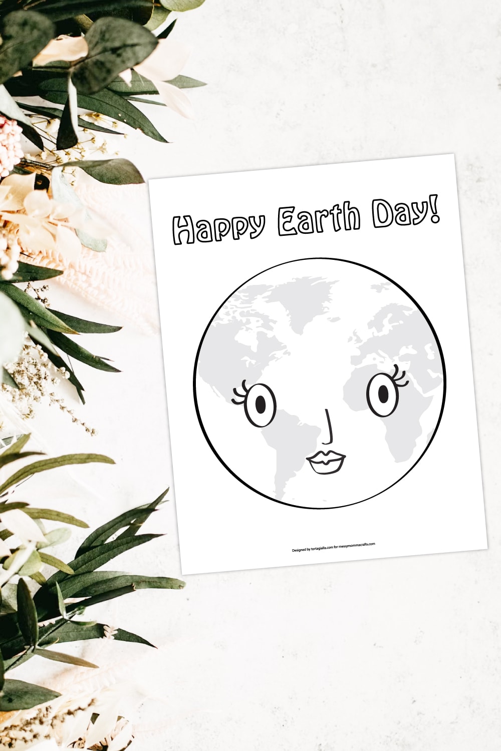Preview of happy earth day coloring page illustration on white background with white flowers and green leaves on the left side border. 
