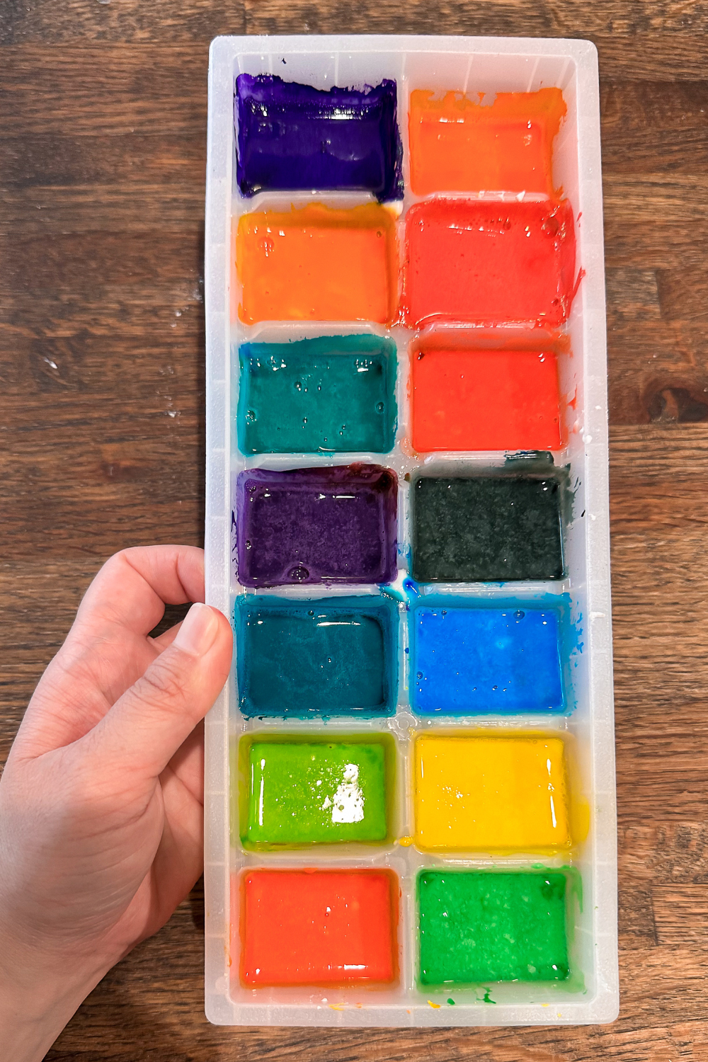 Homemade watercolor paints in a ice cube tray. Paints are wet.